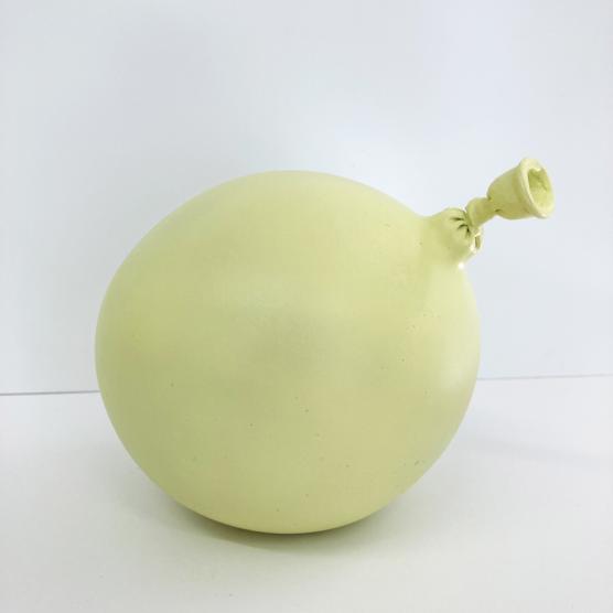 Yellow cast sculpture of a balloon