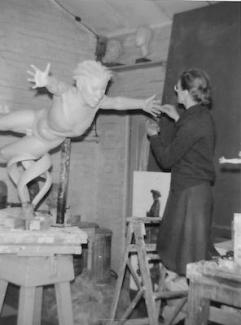 Rose Gwynneth Holt FRBS (1909-1995) working on West Wind in her studio