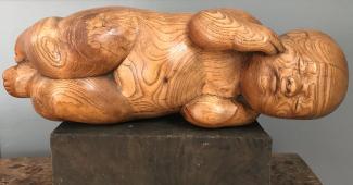 Constance Anne Parker, wooden carving of a baby, 1950s