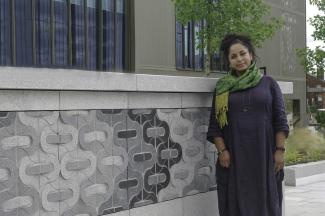 Halima Cassell FRSS standing by her Preston Campus commission
