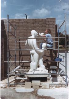 Glynis working on 'Family Group' 1981, commissioned by Stevenage Development Corporation and now sited at Stevenage Town Centre. Carved in Lepine limestone at Chichester Stoneworks.