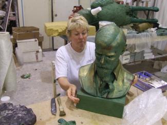 Diana Thomson FRSS working at the Foundry on the wax portrait of DH Lawrence