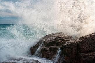 Waves hitting against a rocky shore