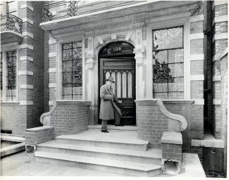 Cecil Thomas at the entrance of 108 Old Brompton Road