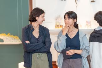 Two students talking in the Royal Society of Sculptors gallery