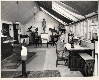 Cecil Thomas OBE FRBS working in his studio at Dora House
