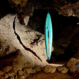 Following the Journey - is suspended from the cave ceiling at Clearwell Caves until 31st August