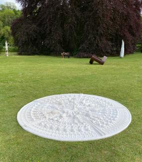 Many UK buildings have historical ties to the transatlantic slave trade, a deeply cruel and discriminatory system that left a legacy of suffering and inequality. Representative objects are arranged as a Ceiling Rose, an architectural feature seen in many grand buildings, built by exploitive people who benefited financially by taking away the freedom of others. 