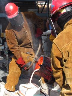 Coles pouring crucible iron at the 2024 Western Conference in California