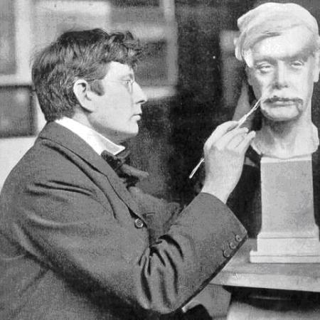 Sir George Frampton PPRSS at work on a sculpture