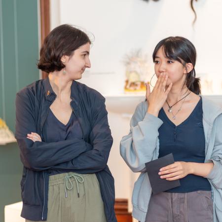 Two students speaking to one another at the launch event